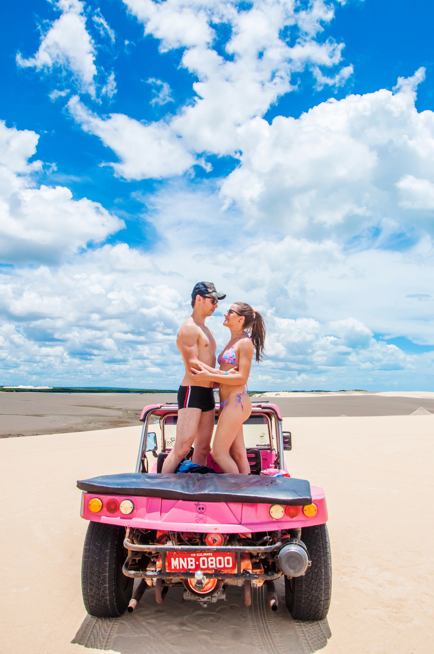 Man and Woman Looking at Each Other While Standing on a Buggy