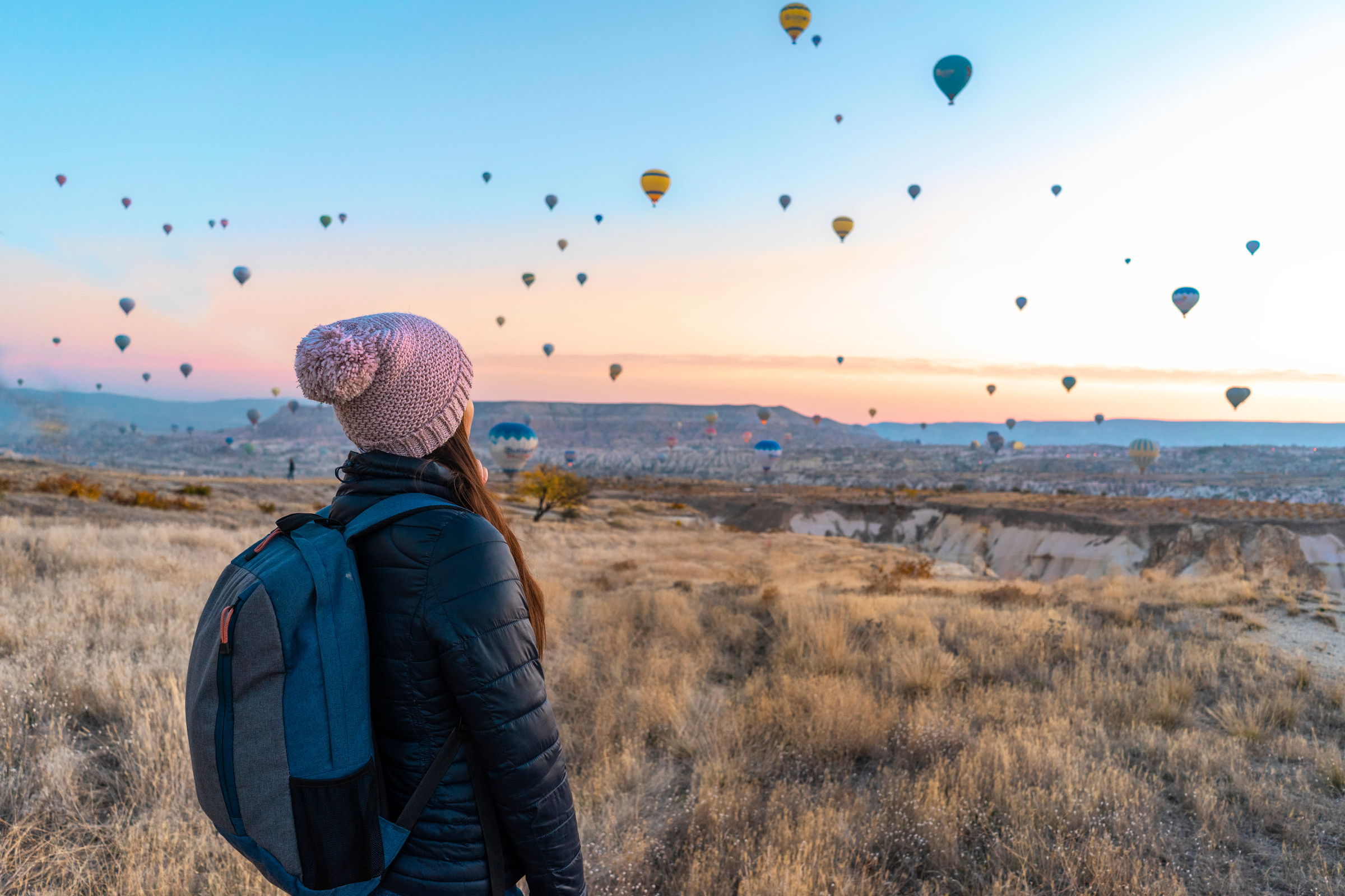 Woman Looking At Hot Air Balloons